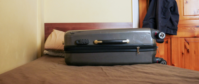 Suitcase on a bed