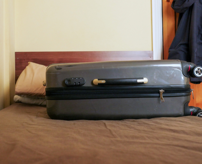 Suitcase on a bed
